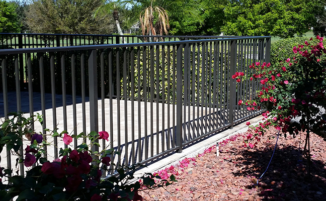 aluminum fence bordered by rose garden in delray beach florida